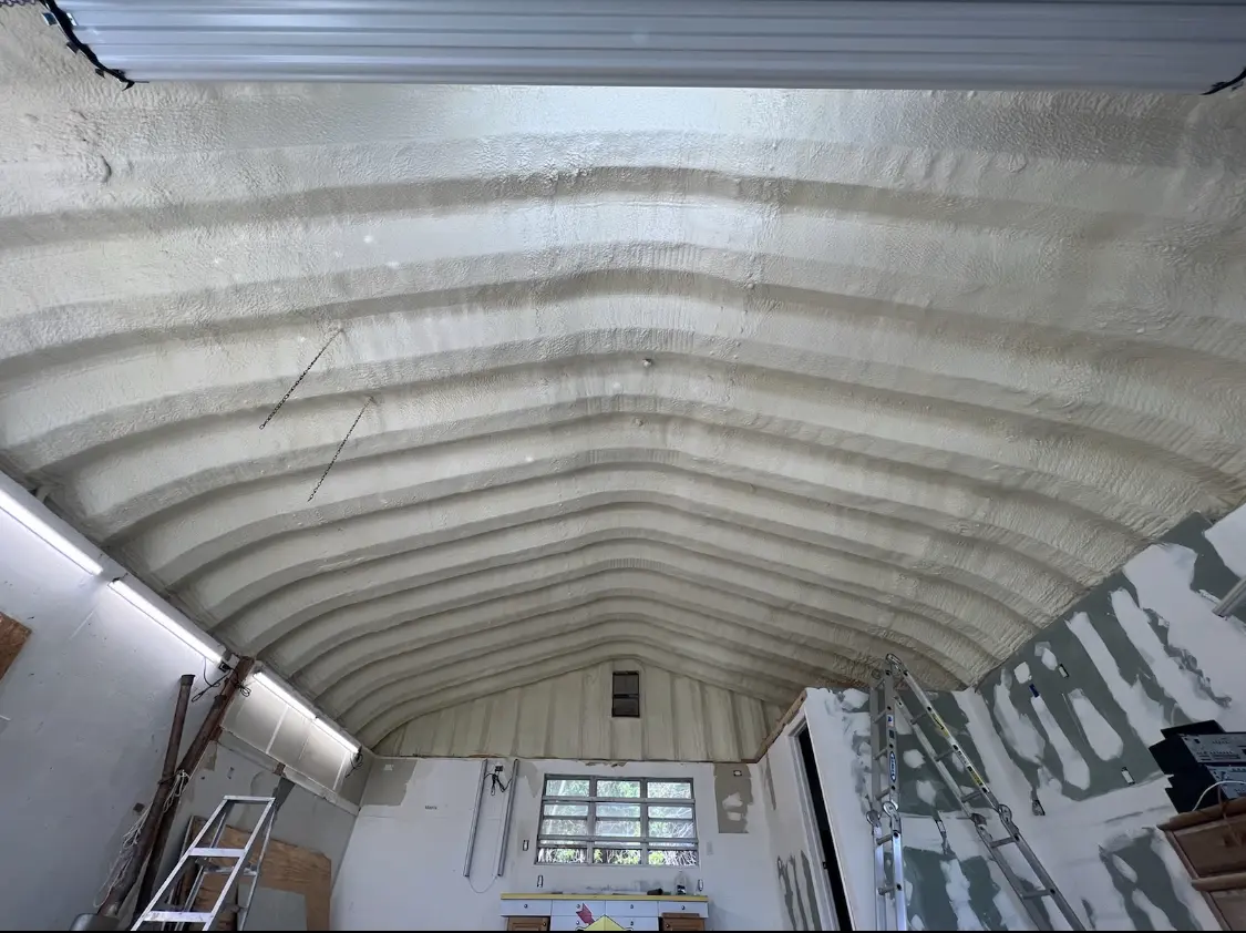 Spray polyurethane foam applied to the underside of a metal roof deck in Corpus Christi